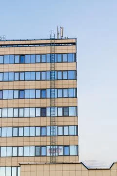 Fire escape ladder on the facade of the high rise building. Safety 库存照片