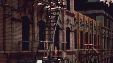 A fire escape next to a brick building Ilustración de archivo
