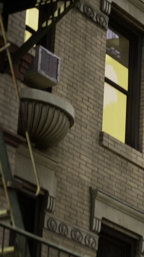 Fire escape outside building on a street in a city during daytime Stock Footage 334248003