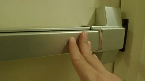 Fire exit door. Man hand open the fire door to staircase hallway. Stock Footage 171067689