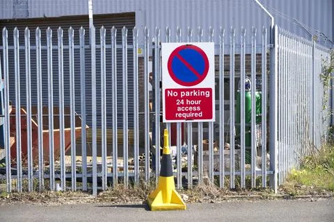 Fire exit keep clear sign on construction building site door Stock Photos