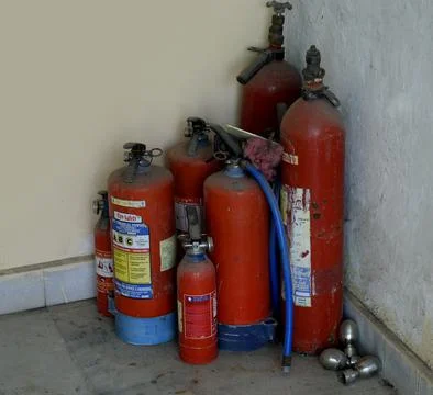 Fire extinguisers or fire fighting equipment Stock Photos