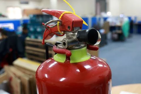A fire extinguisher is an active fire protection device used to extinguish Stock Photos