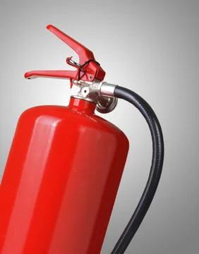 Fire extinguisher on gray background Stock Photos