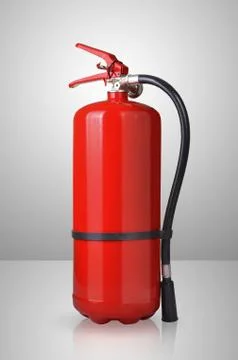Fire extinguisher on gray background Stock Photos