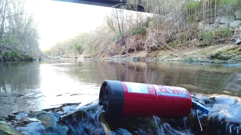 Fire extinguisher in river environmental pollution scene 4K Stock Footage 330270305
