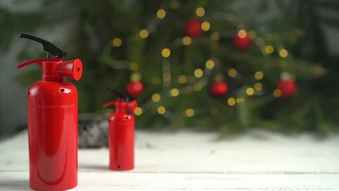 The fire extinguisher stands on a white table, against the background of a Stock Footage 224570501