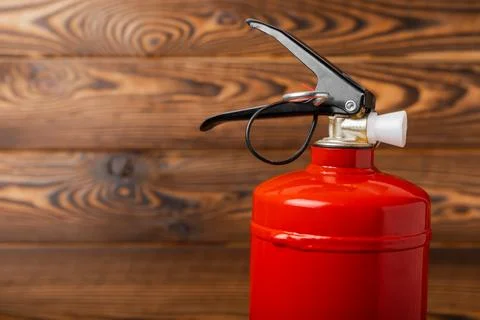 Fire extinguisher on  texture background Photos
