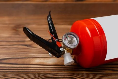Fire extinguisher on  texture background Photos