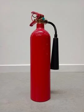 Fire extinguisher in the work environment Stock Photos