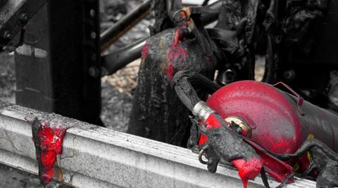Fire extinguishers burned during a fire Stock Photos