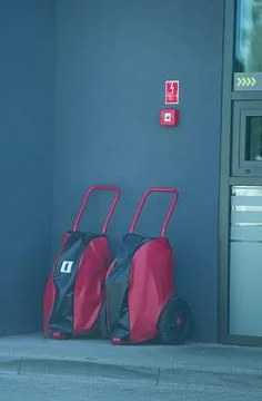 Fire extinguishers in transport covers. Stock Photos