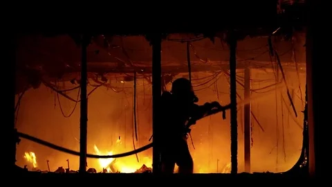 Fire extinguishing, fire brigade inside burning premises Stock Footage 74434563