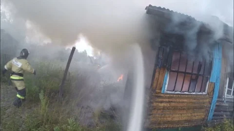 The fire. Extinguishing fire with water. Heavy smoke. Stock Footage 80450176
