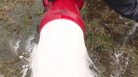 Fire extinguishing foam. Fireman in action activated foam. Stock Footage 111244745