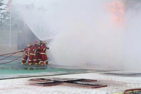 Fire extinguishing Stock Photos
