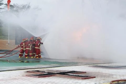 Fire extinguishing Stock Photos