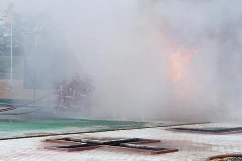 Fire extinguishing Stock Photos