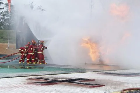 Fire extinguishing Stock Photos