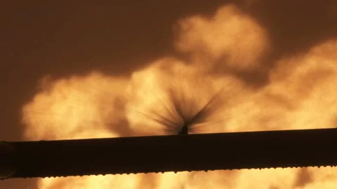 Fire extinguishing system. Water is sprayed onto flame. Drops of water flow down Stock Footage 209592412