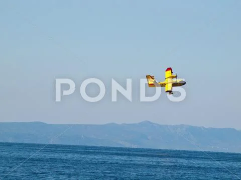 Fire fighter airplane in action Stock Photos