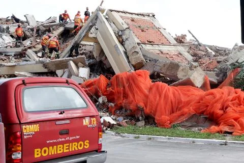 Fire Fighter inspecting the rubble of The Torre Palace Hotel in Brasilia Stock Photos