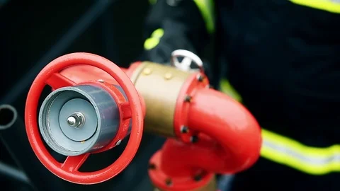 Fire fighter staying in position next to a hydrant Video stock 120938675