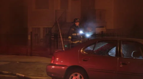 Fire fighter walks with flashlight Stock Footage 42264693