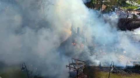Fire fighter in white hat with smoke filter sprays water &amp; extinguish the fire 스톡 동영상 113112208