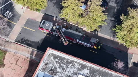 Fire Fighters conducting a training session from a top warehouse Vidéo 261937346
