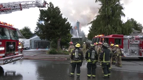 FIRE FIGHTERS AT HOUSE FIRE Stock Footage 247342612