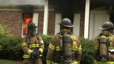 FIRE FIGHTERS OUTSIDE WINDOW FLAMES Stock Footage 93402191