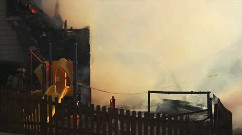 Fire fighters putting out fire Stock Footage 22196337