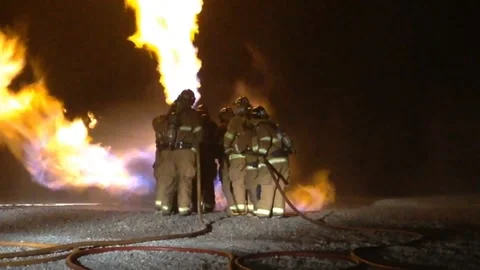 Fire fighters putting out large fire Video stock 290473211