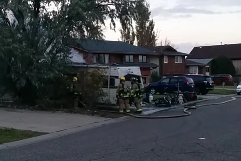Fire fighters at suspected meth lab Stock Footage 162865417