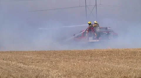 Fire Fighters work a large grass Fire Stock-Footage 46908222