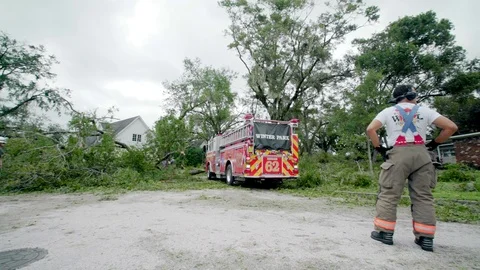 Fire fighters working to clear the streets after Hurrican Irma. Stock Footage 80339371