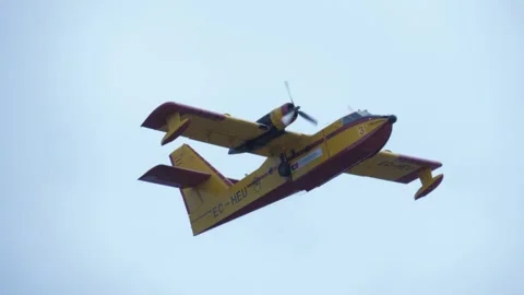 Fire fighting airplane working slow motion Stock Footage 284371175