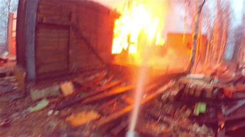 Fire. Firefighter extinguishes fire . Stock Footage 55610892