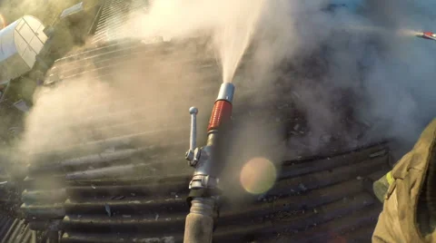 Fire. Firefighter extinguishes fire. Strong smoke. Stock Footage 63818631
