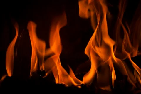 Fire in the fireplace with a black background Stock Illustration