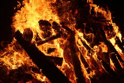 Fire in fireplace on black Stock Photos