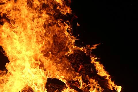 Fire in fireplace on black Stock Photos