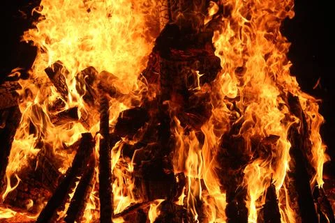 Fire in fireplace on black Stock Photos