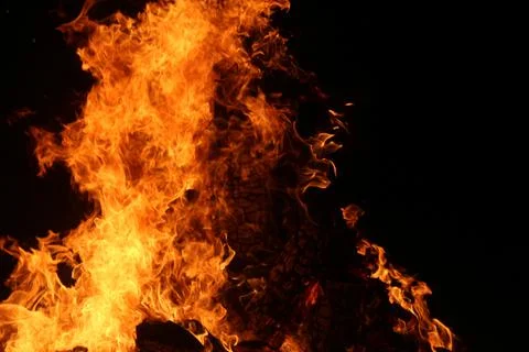 Fire in fireplace on black Stock Photos