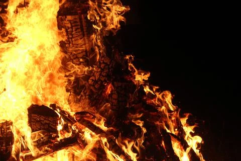 Fire in fireplace on black Stock Photos