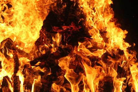 Fire in fireplace on black Stock Photos