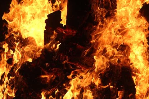 Fire in fireplace on black Stock Photos