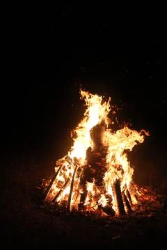 Fire in fireplace on black Stock Photos