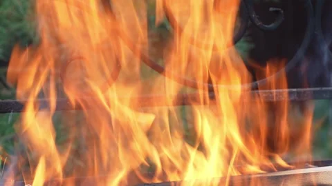 Fire in the fireplace, close-up of a flame in a backyard grill Stock Footage 312315652